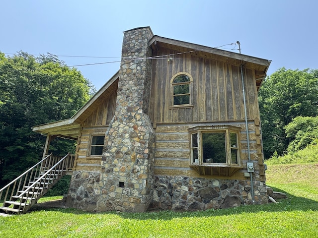 453 Trentham Hollow Rd, Parrottsville, TN 37843 - view of home's exterior with a chimney, a lawn, stairway, and stone siding