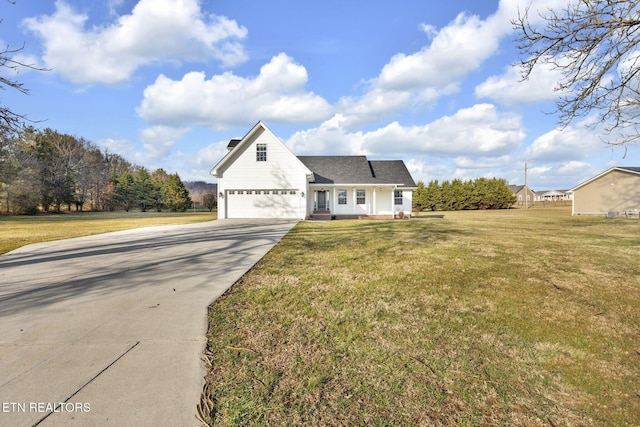 view of front of home with a garage, concrete driveway, and a front lawn