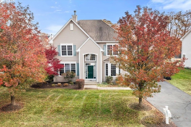 view of front of property with a front lawn