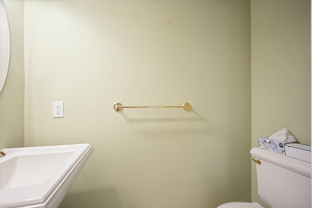 bathroom with toilet and sink