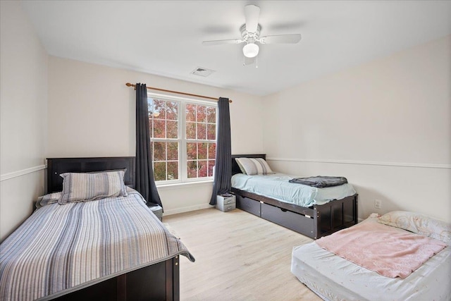 bedroom featuring ceiling fan and light hardwood / wood-style floors