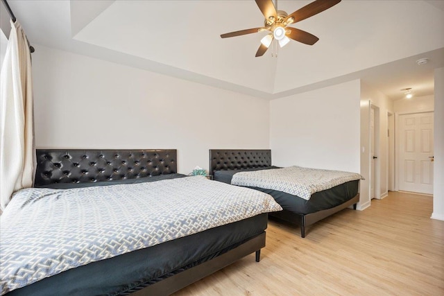 bedroom with ceiling fan and light wood-type flooring