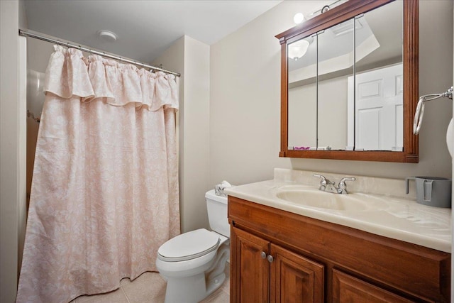 bathroom featuring tile patterned floors, vanity, and toilet