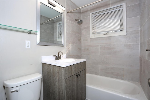 full bathroom featuring vanity, toilet, and tiled shower / bath