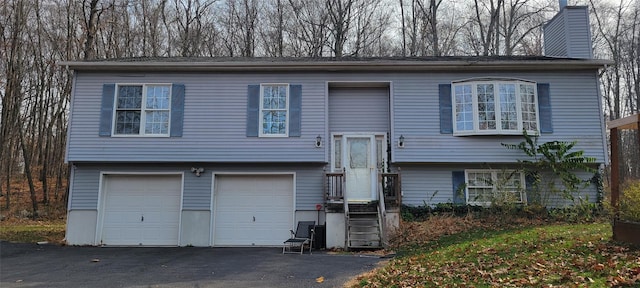 bi-level home featuring a garage