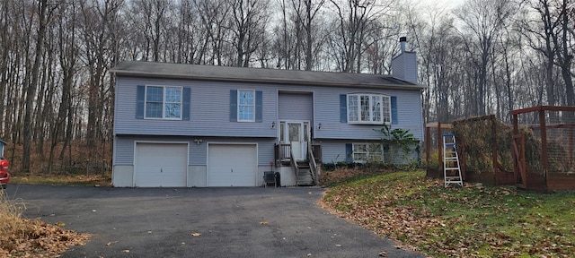 split foyer home featuring a garage