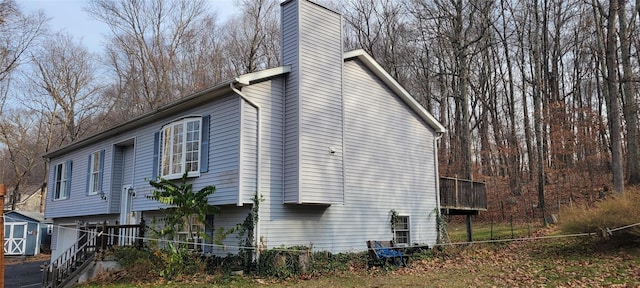 view of side of property with a shed