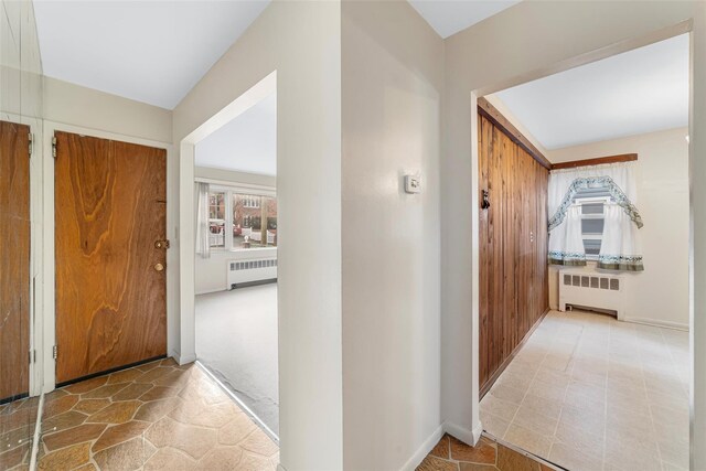 entryway featuring radiator heating unit