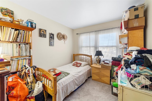 bedroom with light carpet