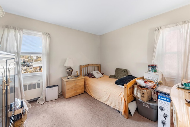 carpeted bedroom featuring radiator heating unit