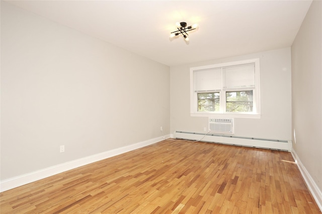 unfurnished room featuring a notable chandelier, an AC wall unit, a baseboard radiator, and light hardwood / wood-style flooring