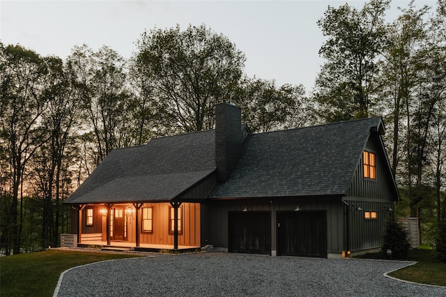 view of front of home with a front yard and a garage