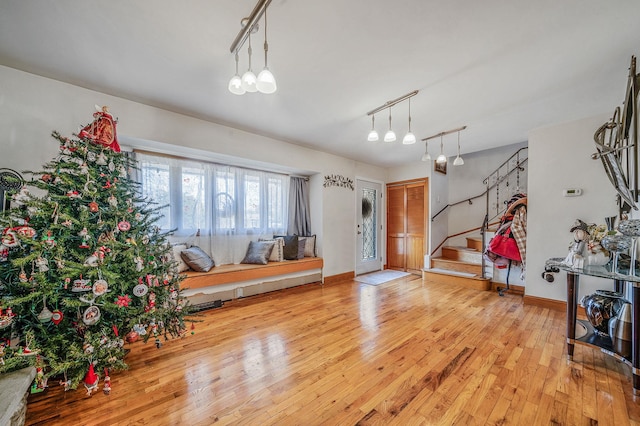 entryway featuring light hardwood / wood-style floors and track lighting