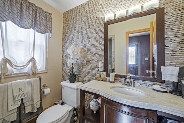 bathroom with vanity and toilet