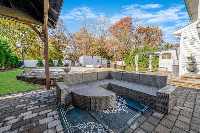 view of patio / terrace featuring outdoor lounge area and a shed