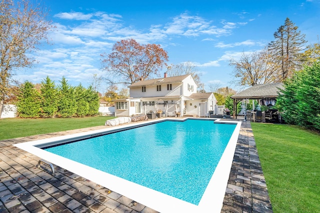 view of swimming pool with a gazebo, a yard, and a patio area