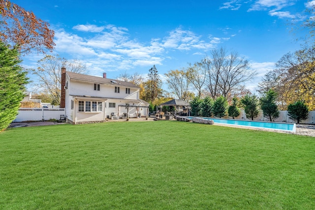 view of yard with a gazebo and a fenced in pool