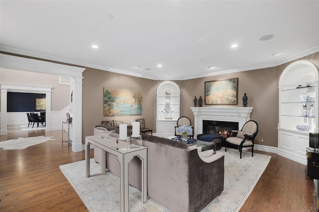 living room featuring ornamental molding and light wood-type flooring