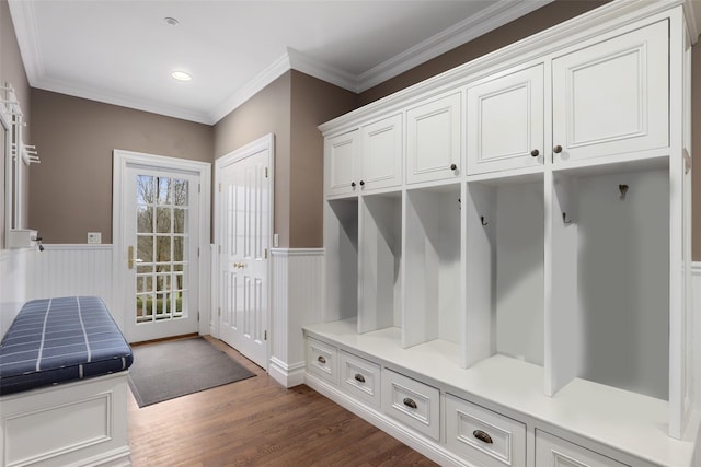 mudroom with dark hardwood / wood-style floors and ornamental molding