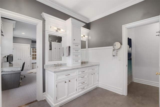 bathroom featuring vanity and ornamental molding