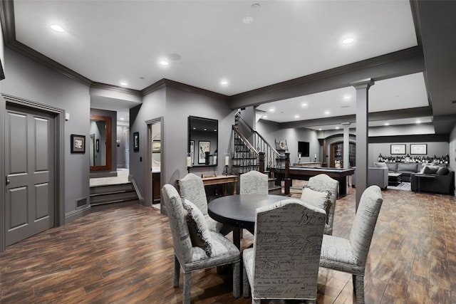 dining space with dark hardwood / wood-style floors, crown molding, pool table, and decorative columns