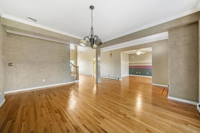 unfurnished dining area featuring ceiling fan with notable chandelier, light wood-type flooring, and crown molding