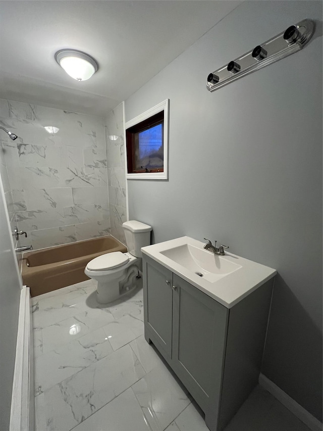 full bathroom with tiled shower / bath, vanity, and toilet