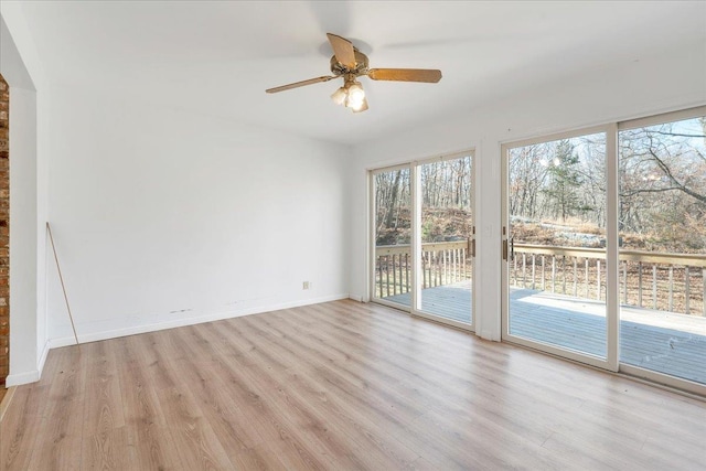 unfurnished room featuring ceiling fan and light wood-type flooring