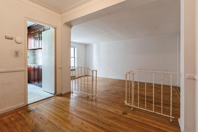 interior space featuring light hardwood / wood-style flooring and ornamental molding