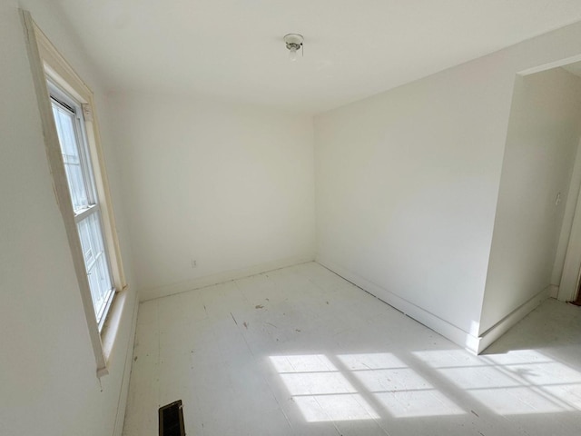 unfurnished room featuring a healthy amount of sunlight