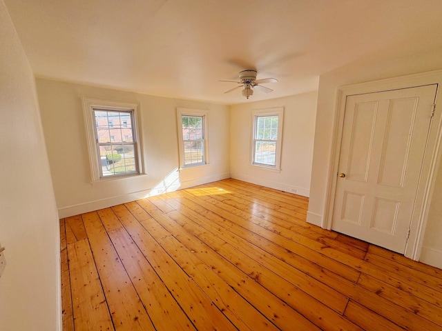 spare room with ceiling fan and light hardwood / wood-style floors