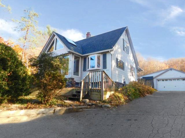 452 St Andrews Rd, Walden, NY 12586 - view of home's exterior featuring an outdoor structure, a chimney, and a detached garage