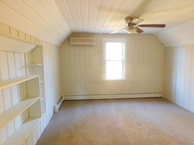 bonus room with vaulted ceiling, ceiling fan, light carpet, and a wall mounted air conditioner