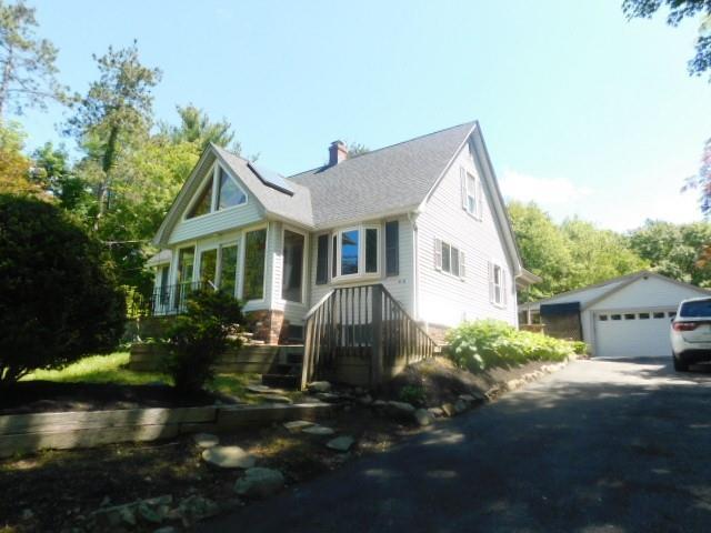 452 St Andrews Rd, Walden, NY 12586 - view of front of house featuring a detached garage, an outbuilding, and a chimney