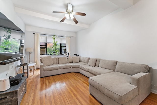 living room featuring ceiling fan and light wood-type flooring