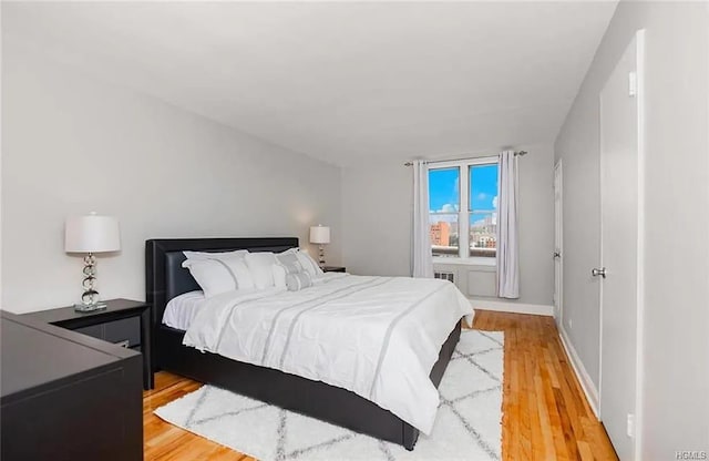 bedroom with light hardwood / wood-style floors