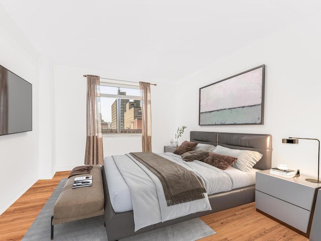 bedroom with light hardwood / wood-style floors