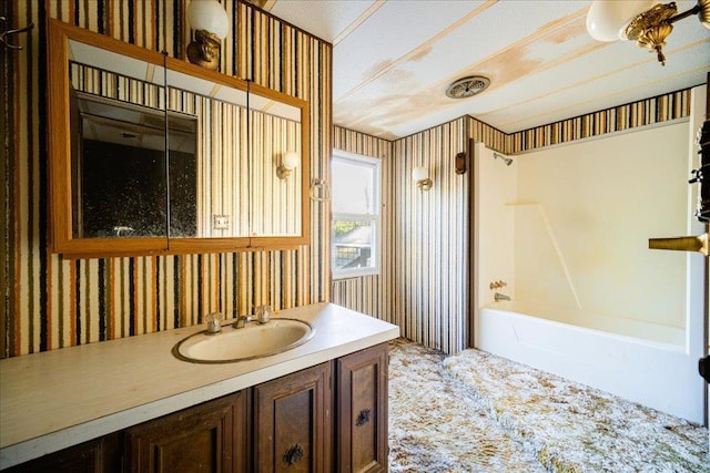 40 Collins Rd, Eldred, NY 12732 - full bath with wallpapered walls, vanity, and shower / tub combination
