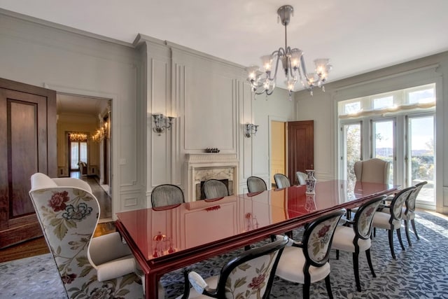 dining area featuring an inviting chandelier and ornamental molding