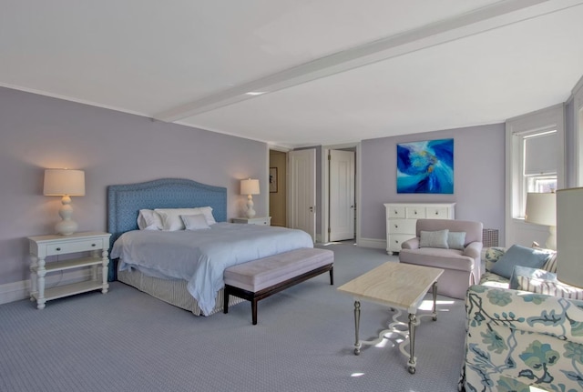 carpeted bedroom featuring beam ceiling