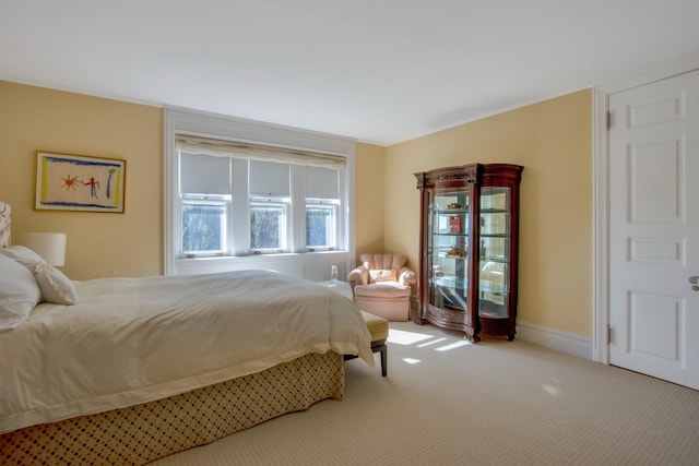 bedroom with light colored carpet