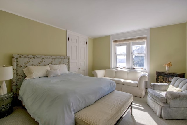 bedroom featuring light carpet