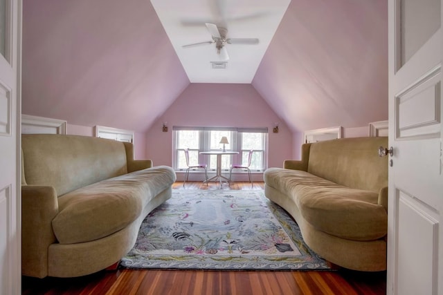 living room featuring hardwood / wood-style flooring, lofted ceiling, and ceiling fan