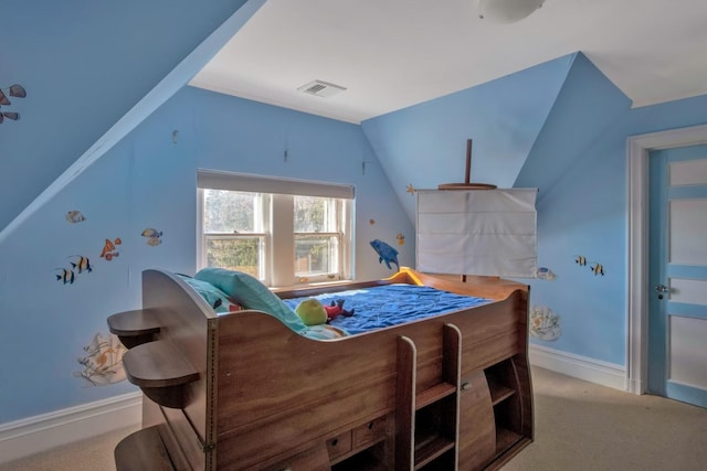 bedroom featuring light colored carpet and vaulted ceiling