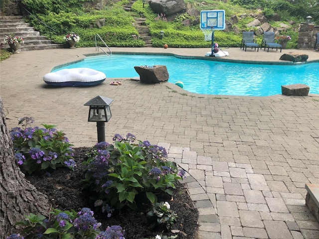 view of pool featuring a patio area