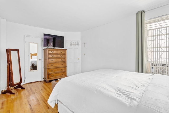 bedroom with wood-type flooring