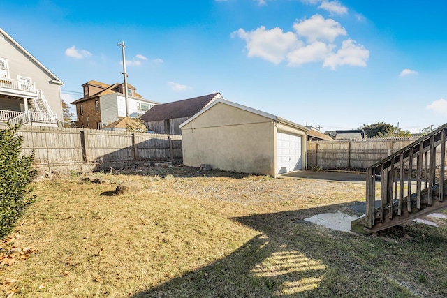 view of yard with an outbuilding and a garage