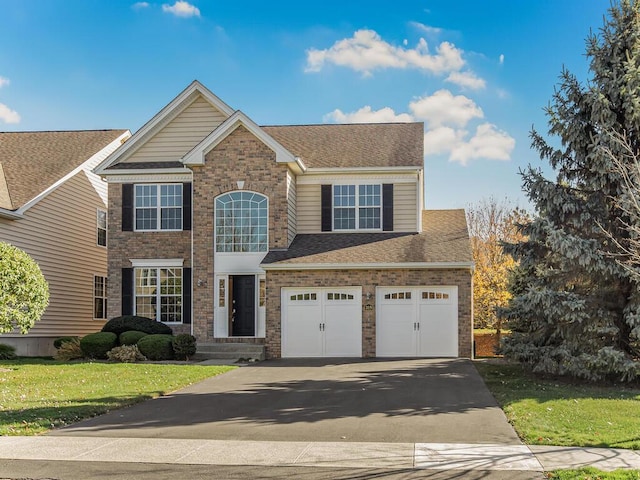 view of front facade featuring a garage and a front lawn