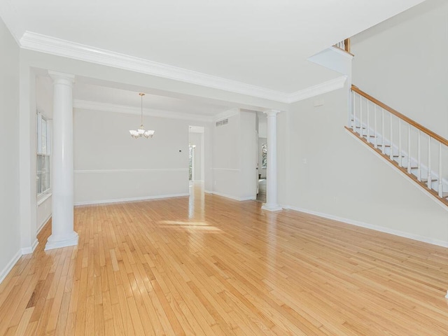 unfurnished living room featuring a chandelier, light hardwood / wood-style floors, and ornamental molding