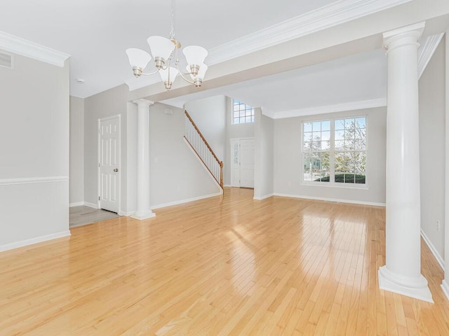 interior space with light hardwood / wood-style flooring, ornamental molding, and a notable chandelier